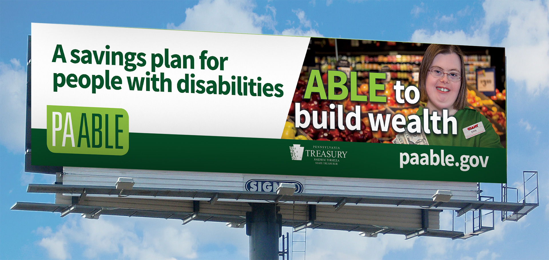 An outdoor billboard depicting PA ABLE campaign graphics