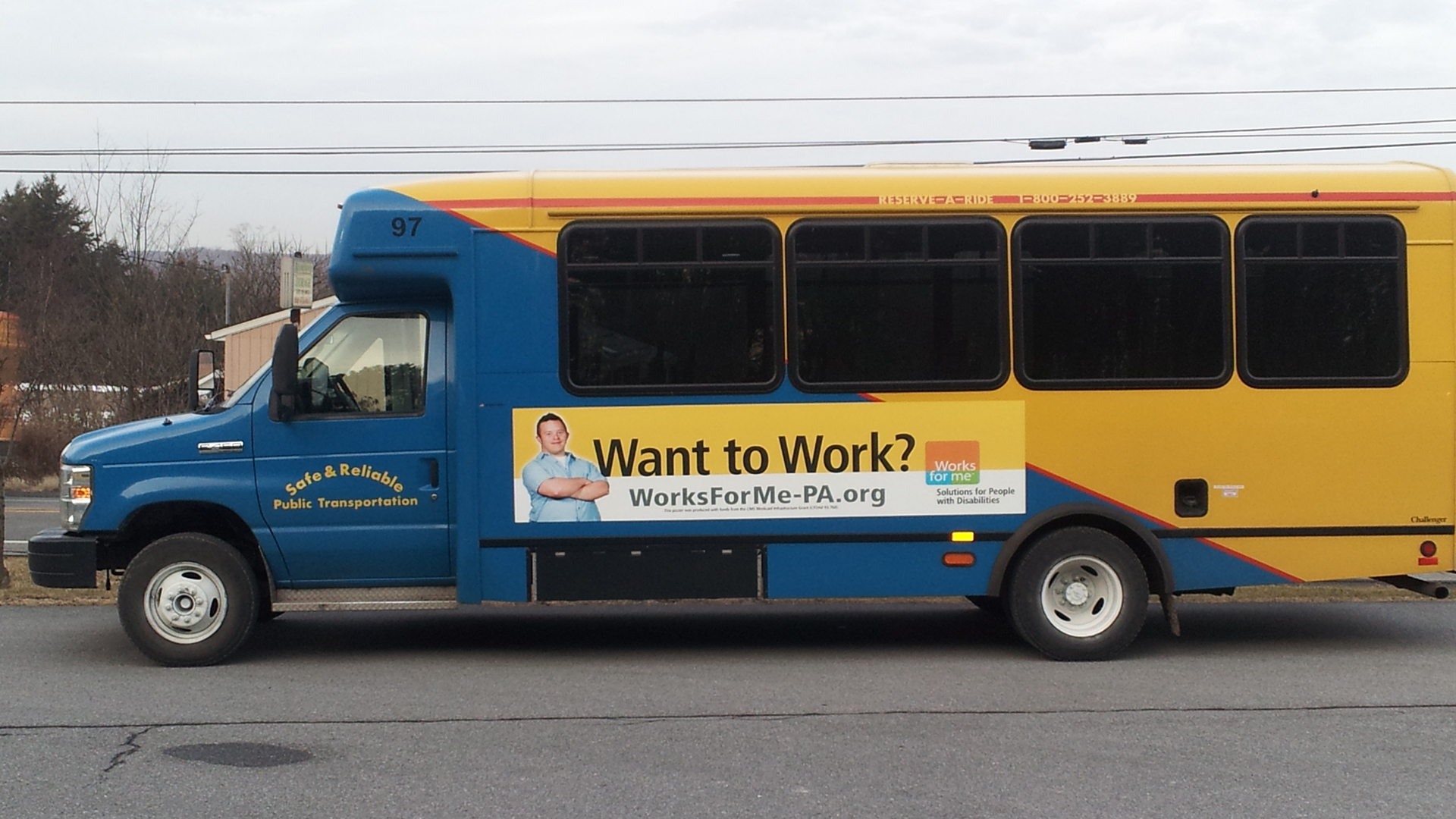 A Works for Me advertisement on the side of a bus